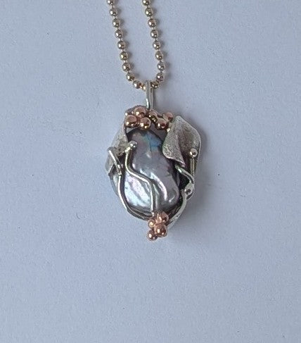 Iridescent silver Pearl set in Sterling silver and rose gold