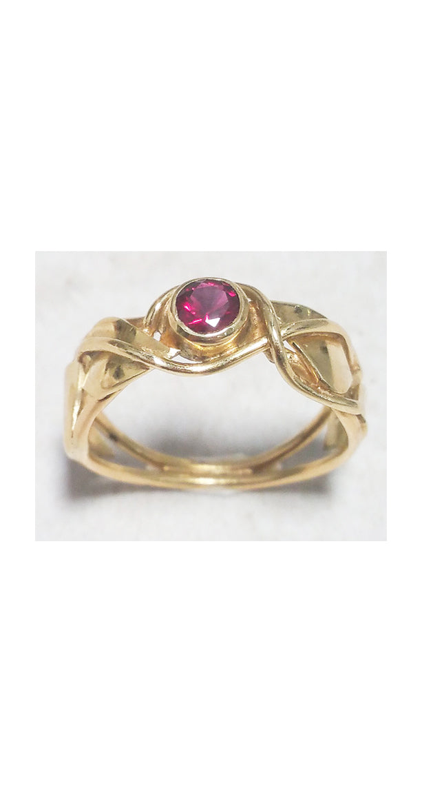 SOLD: Band style ring with bezel set garnet