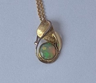 Ethiopian opal set in 18K Royal yellow gold