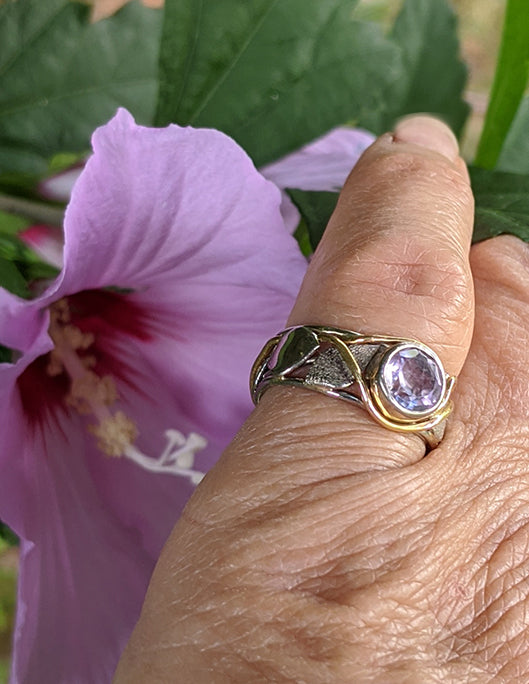 Band style ring with bezel set amethyst