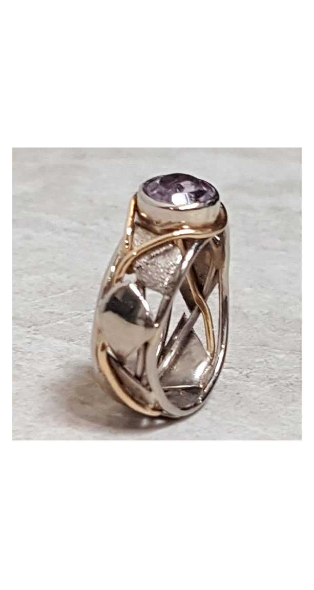 Band style ring with bezel set amethyst