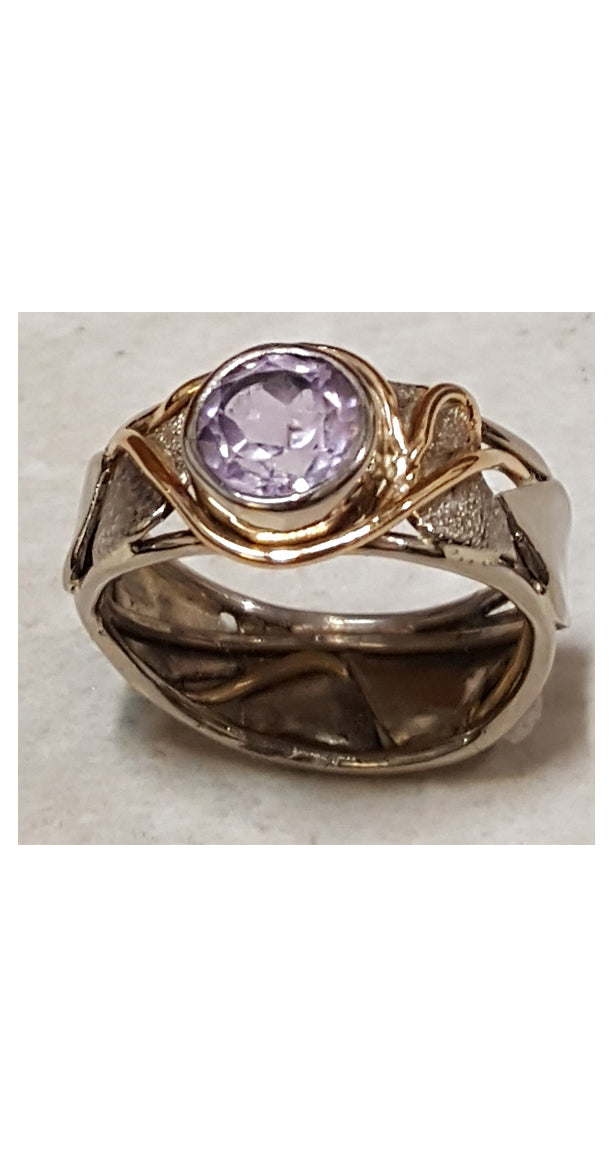 Band style ring with bezel set amethyst