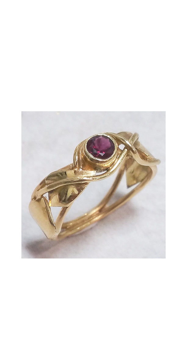 SOLD: Band style ring with bezel set garnet